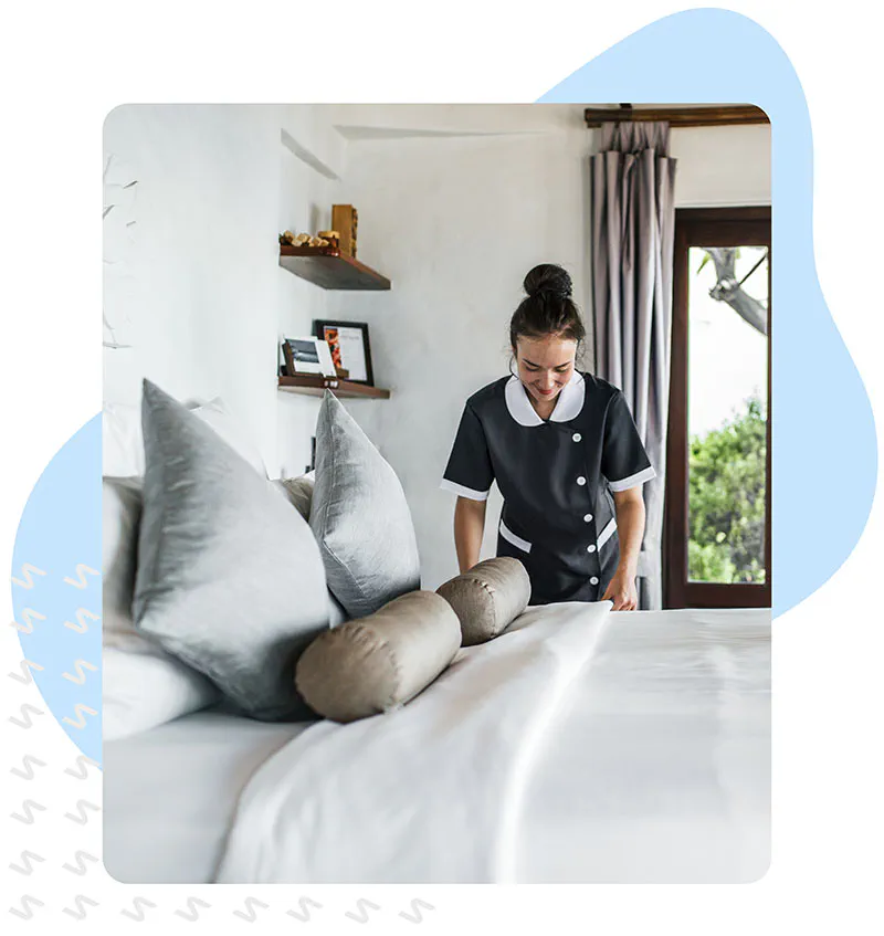 Maid cleaning a hotel room