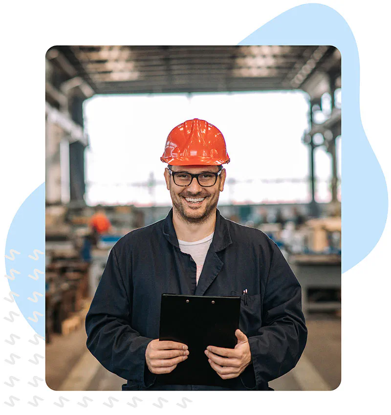 Man on construction site with a tablet