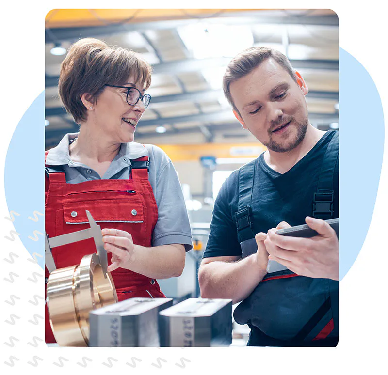 Man and woman in a factory working on scheduling