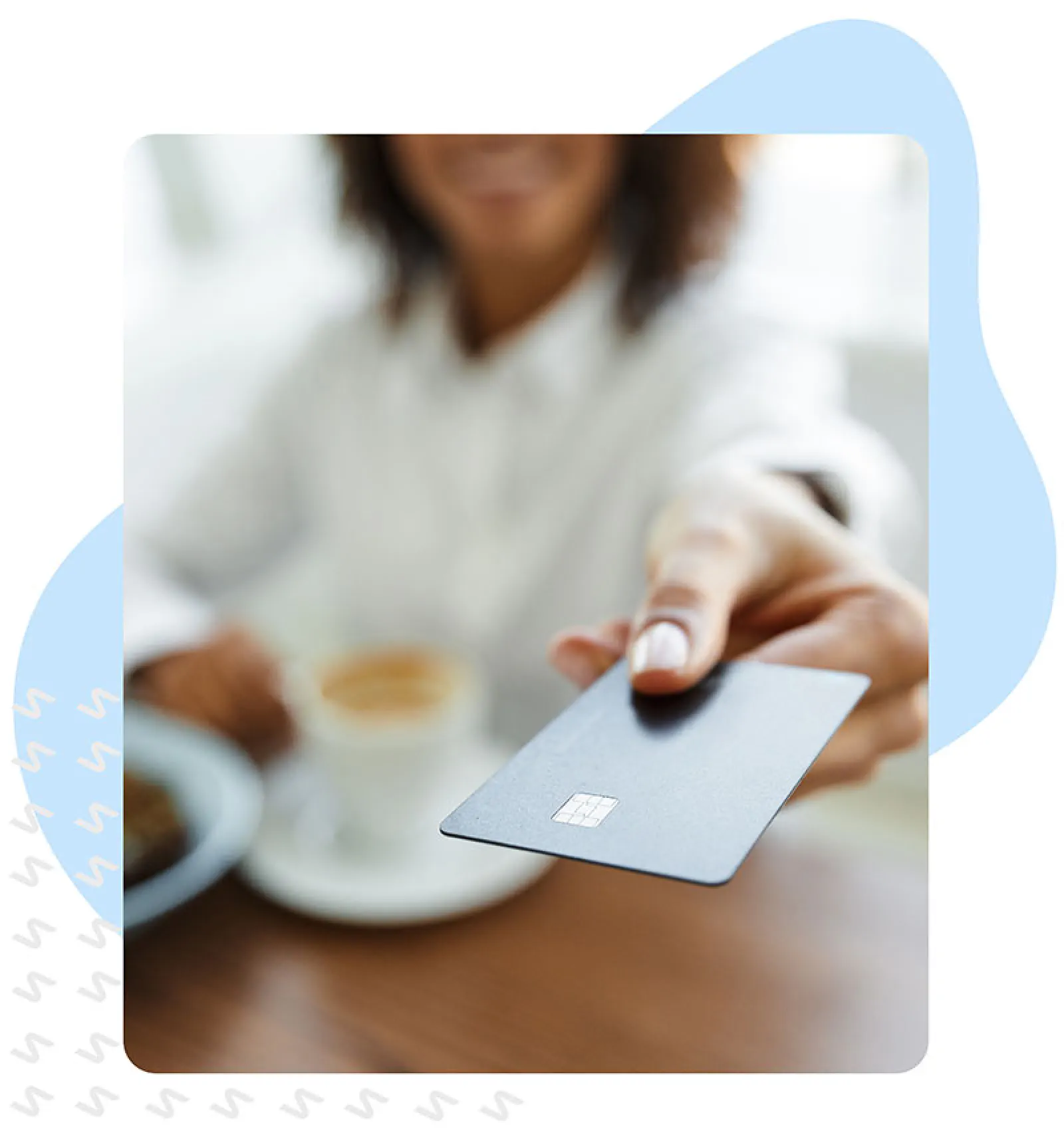 Woman handing over a credit card